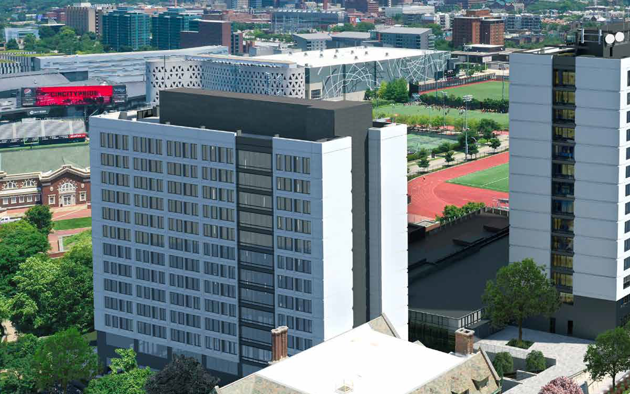 Exterior of Siddall Hall. The rectangular brick building has eleven floors of rooms with tinted windows.
